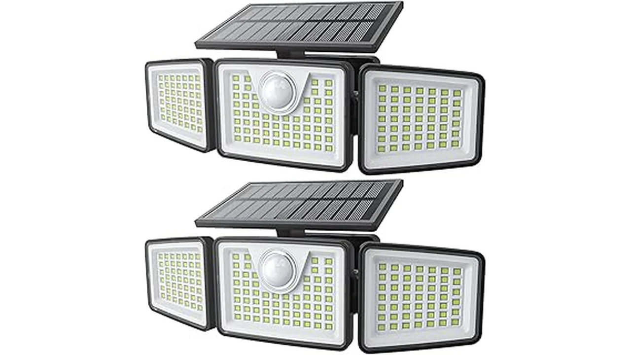 The image shows several bright solar motion sensor lights mounted on a wall in an outdoor setting.
