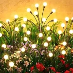 The image shows a lush Florida garden illuminated by a variety of best-selling outdoor lights.