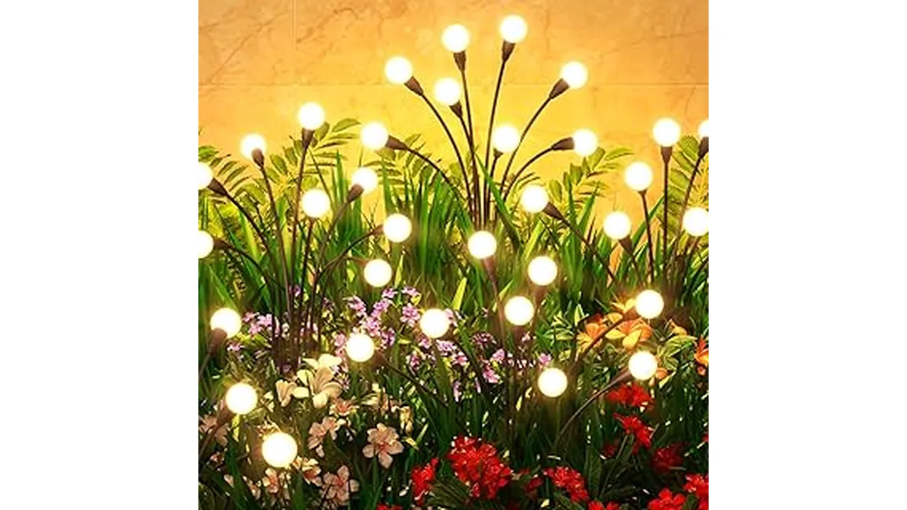 The image shows a lush Florida garden illuminated by a variety of best-selling outdoor lights.