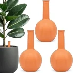 The image shows various stylish ceramic watering globes in vibrant colors, perfect for houseplants.