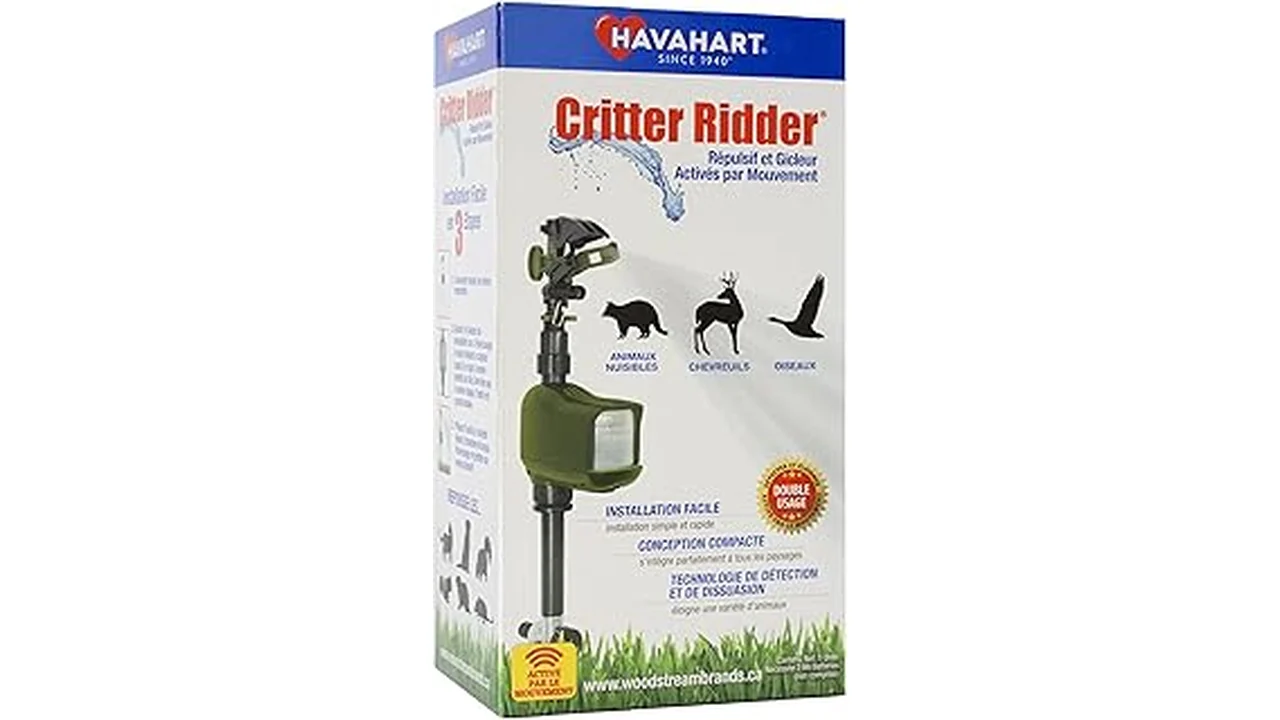 The image shows a motion activated garden sprinkler deterring a critter from a yard.