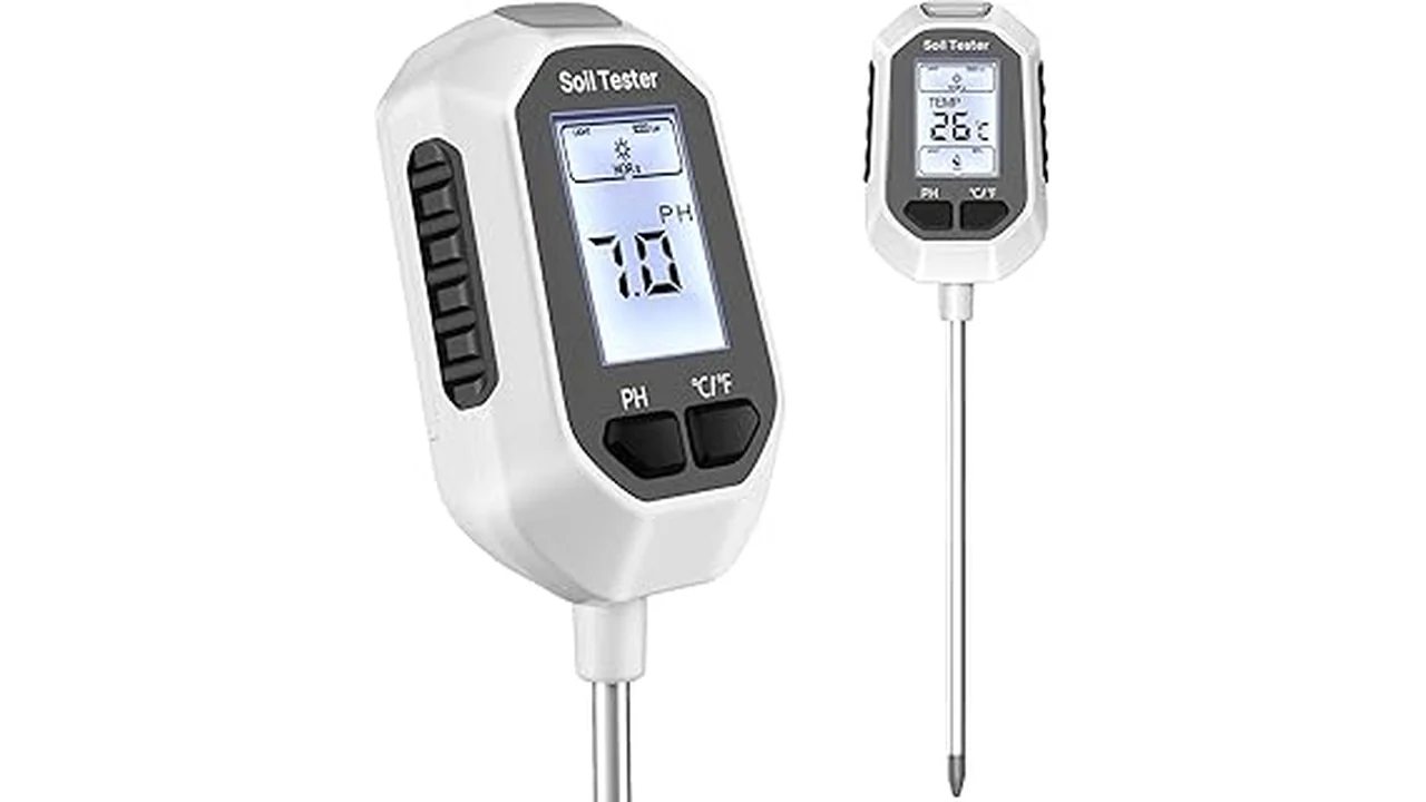 This image shows a digital garden soil thermometer probe inserted into rich, dark soil.