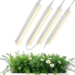 The image shows a high-quality LED grow light illuminating lush green plants in a hydroponic setup.