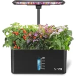 The image shows a vibrant indoor hydroponic garden with lush green plants growing.