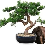 This image shows an artfully arranged artificial bonsai tree, perfect for home decor.
