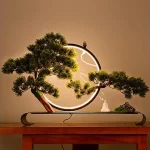 The image shows a glowing artificial bonsai tree with delicate lights, highlighting popular choices from the best selection.