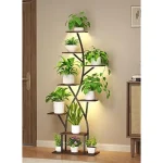 The image shows a variety of stylish indoor plant stands perfect for apartment living.