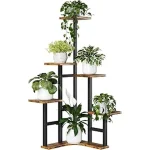 This image shows a stylish wooden tiered plant stand holding several potted green plants.