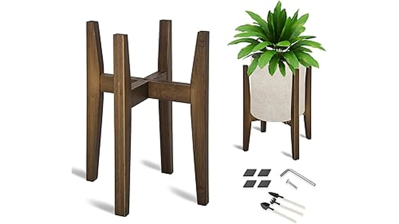 The image shows a stylish mid century wooden indoor plant stand holding a potted plant.