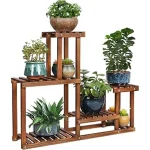 The image shows a beautifully crafted pine wood indoor plant stand, perfect for displaying houseplants.