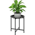 The image shows a stylish modern plant stand holding various indoor plants, perfect for home decoration reviews.