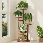 The image shows a stylish wooden plant stand holding several potted plants in a cozy room.