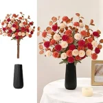 The image shows a beautiful arrangement of realistic artificial flowers in a large vase.